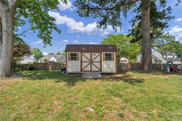 view of shed featuring a fenced backyard
