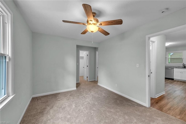 912 W 31st St, Norfolk, VA 23508 - unfurnished bedroom with carpet, baseboards, and ceiling fan