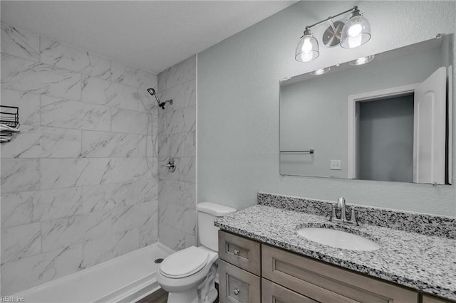 912 W 31st St, Norfolk, VA 23508 - full bath featuring vanity, toilet, tiled shower, and a textured wall