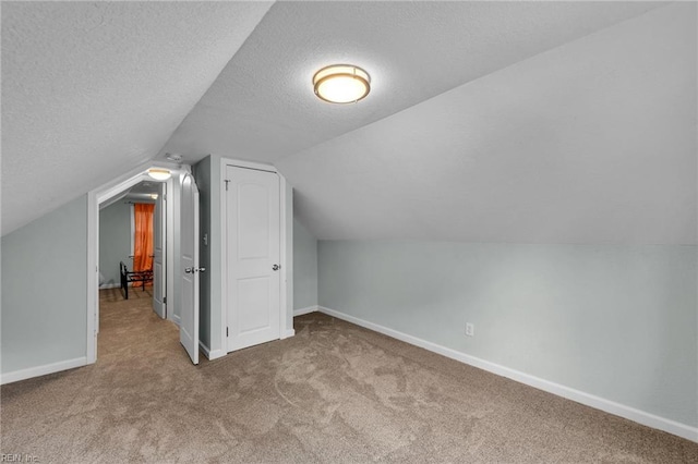 912 W 31st St, Norfolk, VA 23508 - additional living space with a textured ceiling, carpet, and baseboards