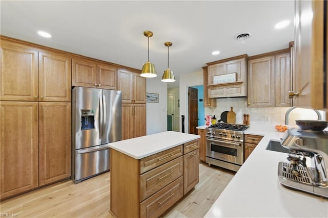 1601 Upton Pl, Suffolk, VA 23433 - kitchen with appliances with stainless steel finishes, backsplash, light countertops, a center island, and light wood-style floors