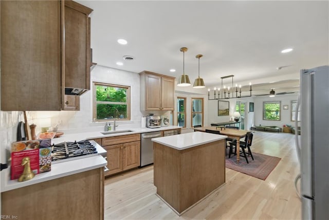 1601 Upton Pl, Suffolk, VA 23433 - kitchen featuring light wood-style flooring, a center island, a sink, open floor plan, and appliances with stainless steel finishes