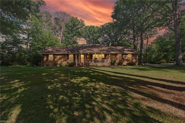 1601 Upton Pl, Suffolk, VA 23433 - ranch-style house with a porch, a chimney, and a lawn