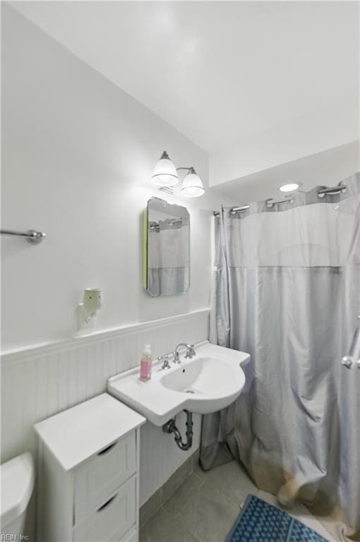 1601 Upton Pl, Suffolk, VA 23433 - bathroom with tile patterned floors, toilet, a shower with curtain, and a wainscoted wall