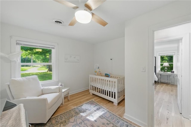 1601 Upton Pl, Suffolk, VA 23433 - bedroom with multiple windows, ceiling fan, visible vents, and wood finished floors