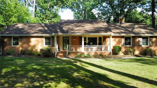 1601 Upton Pl, Suffolk, VA 23433 - single story home featuring a chimney, a front yard, brick siding, and covered porch