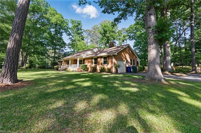 1601 Upton Pl, Suffolk, VA 23433 - ranch-style house featuring a porch, driveway, a garage, a front yard, and a chimney