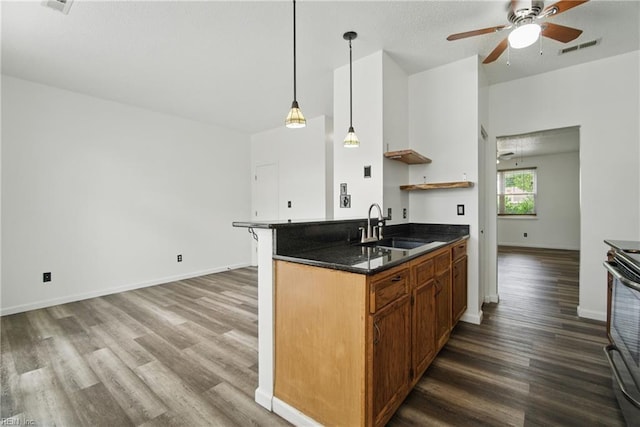 kitchen featuring a sink, range with electric stovetop, wood finished floors, open shelves, and visible vents