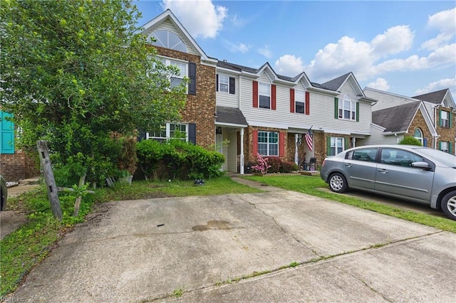 view of property featuring brick siding