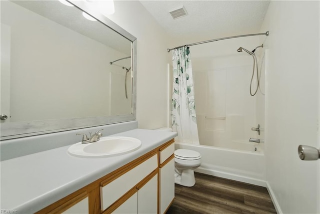 full bath featuring toilet, shower / tub combo with curtain, visible vents, vanity, and wood finished floors