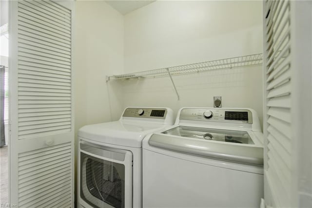 laundry room with washing machine and dryer and laundry area