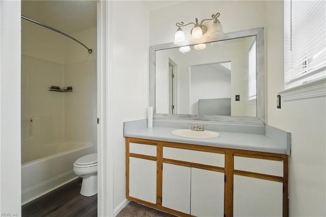 bathroom featuring shower / bath combination, vanity, toilet, and wood finished floors