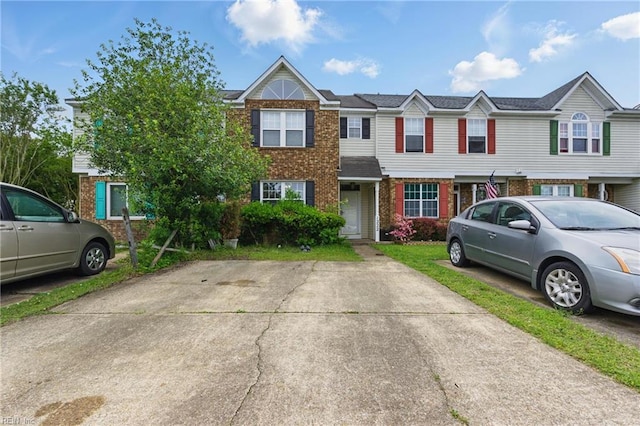 townhome / multi-family property with brick siding