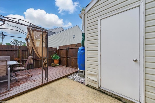 view of outbuilding featuring fence