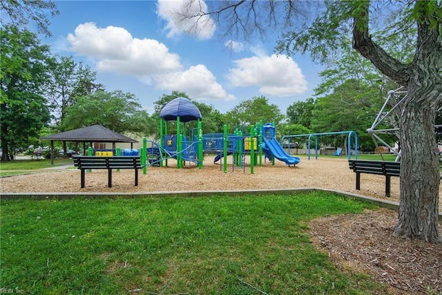 community jungle gym featuring a lawn