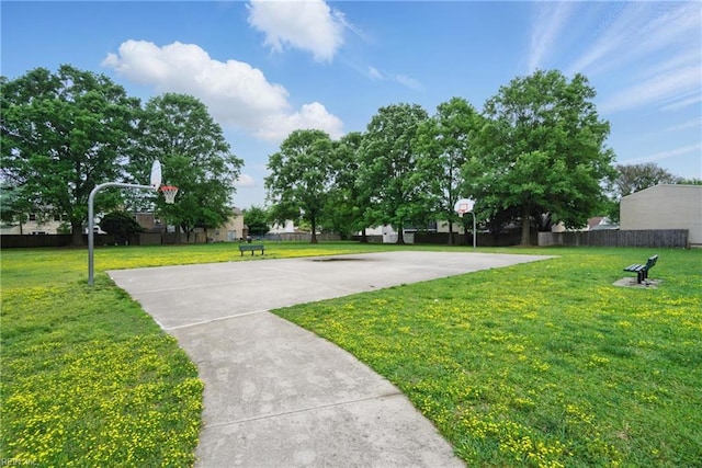 exterior space with basketball hoop and fence