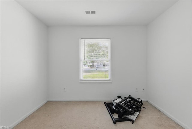 interior space with carpet flooring, visible vents, and baseboards