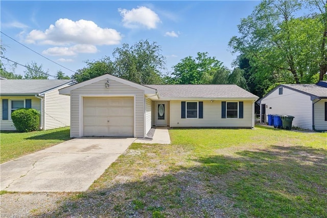ranch-style home featuring a front yard, an attached garage, and driveway