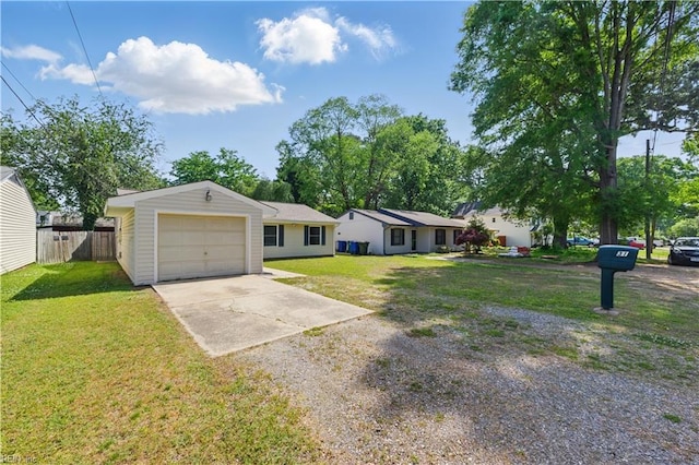 single story home featuring a front lawn, driveway, fence, and a garage