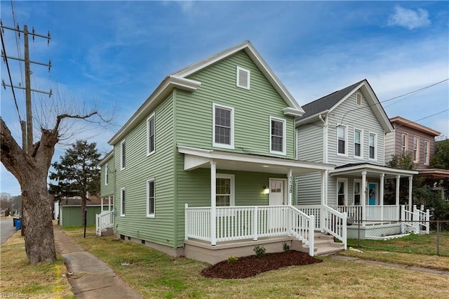 view of front of home featuring a front lawn and a porch