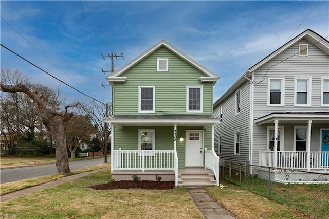 view of front facade with a front yard and a porch