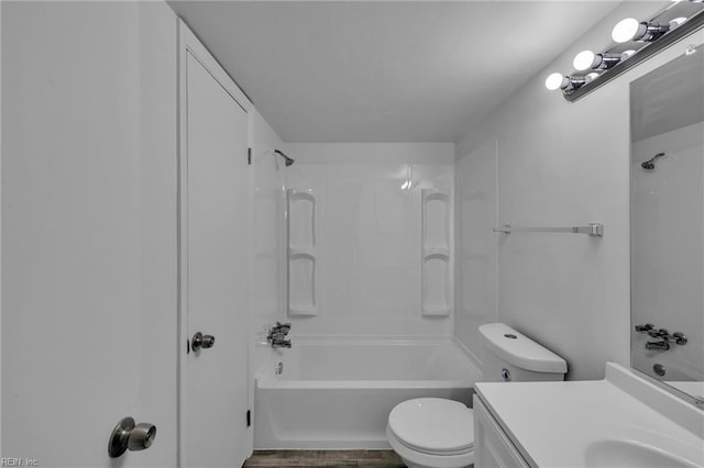 bathroom with shower / bath combination, toilet, and vanity