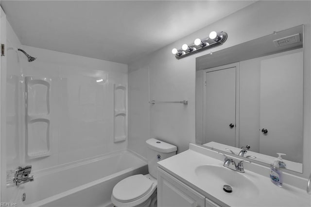 bathroom with toilet,  shower combination, and vanity