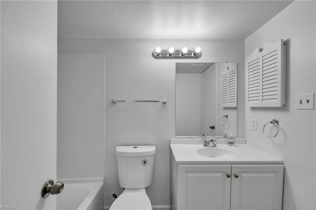 full bath featuring toilet, vanity, and a tub
