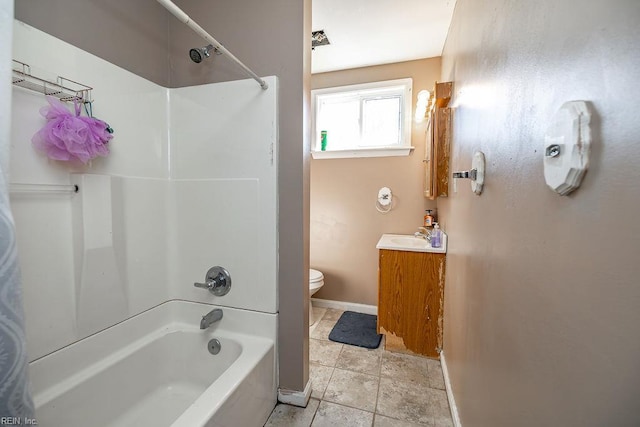 bathroom with shower / bath combination, vanity, toilet, and baseboards