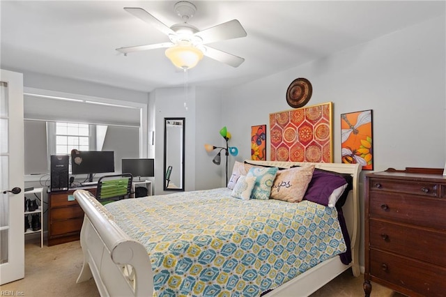 bedroom with light colored carpet and ceiling fan