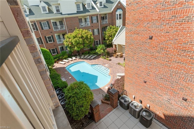 community pool featuring a patio and central AC