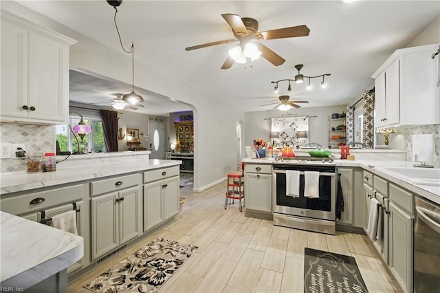 4757 Bunker Hill Ln, Virginia Beach, VA 23462 - kitchen featuring pendant lighting, ceiling fan, a peninsula, decorative backsplash, and stainless steel appliances
