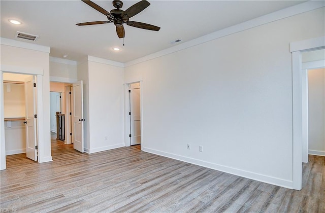 unfurnished bedroom with light wood-type flooring, visible vents, and recessed lighting
