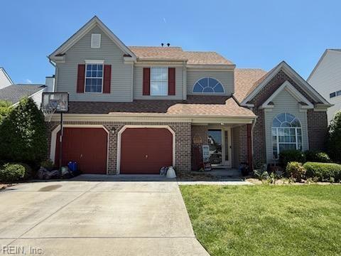 507 Landmark Ct, Chesapeake, VA 23322 - traditional-style home with concrete driveway, a front yard, brick siding, and a garage