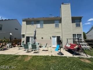 507 Landmark Ct, Chesapeake, VA 23322 - back of house with a patio area, a chimney, and a lawn
