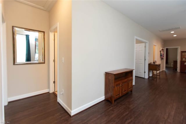 hall featuring recessed lighting, visible vents, baseboards, and dark wood-style floors