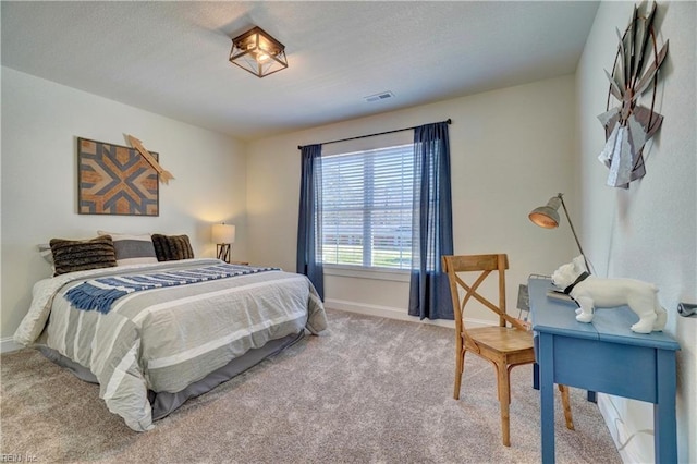 bedroom with baseboards, carpet flooring, and visible vents