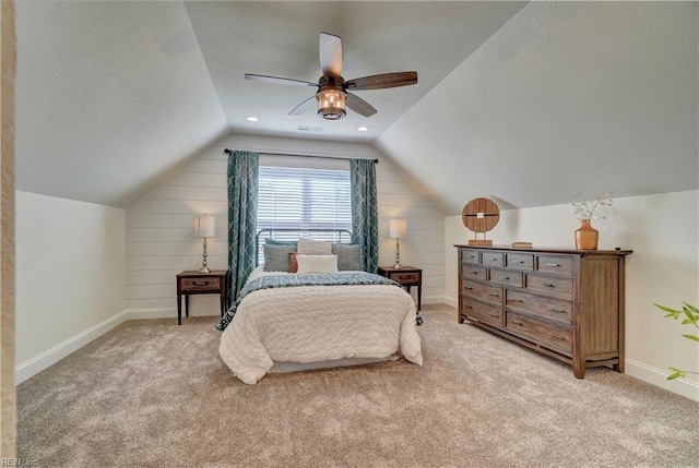 bedroom featuring lofted ceiling, light carpet, and baseboards