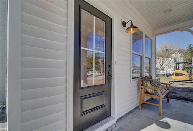 entrance to property featuring a porch