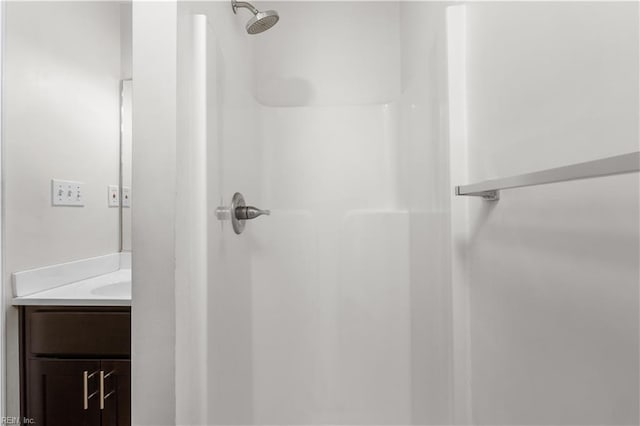 full bathroom featuring a shower stall and vanity