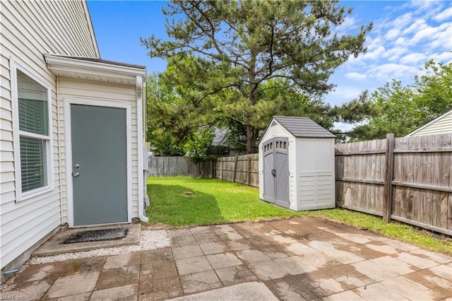 view of patio / terrace with a storage unit and an outdoor structure