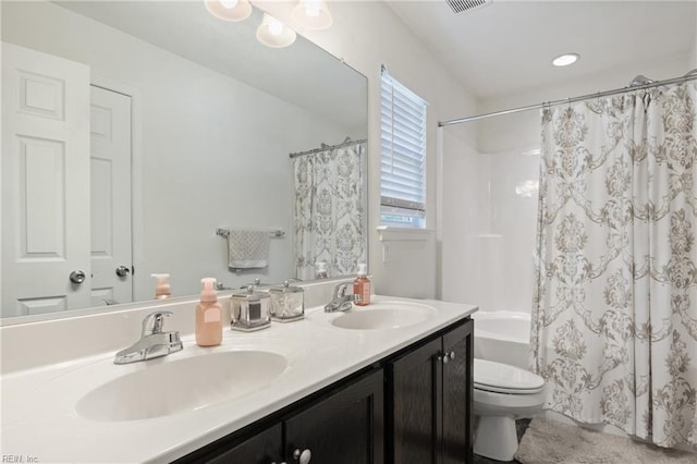 full bathroom featuring toilet, shower / bath combination with curtain, and double vanity
