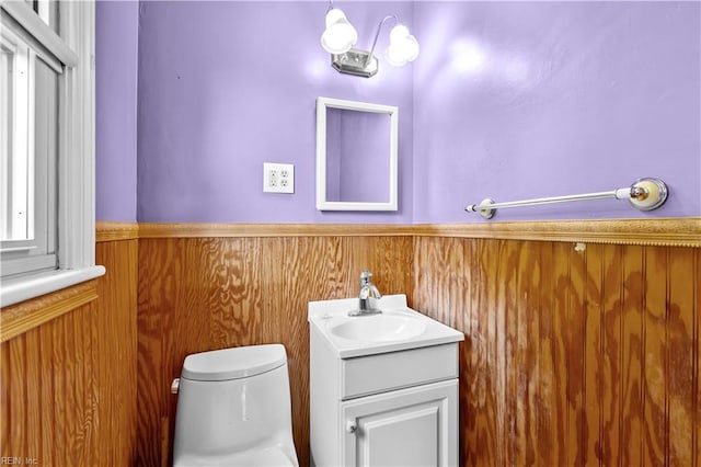 209 Jarvis Rd, Chesapeake, VA 23323 - bathroom with wainscoting, toilet, vanity, and wooden walls