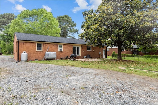 209 Jarvis Rd, Chesapeake, VA 23323 - rear view of property with brick siding, oil tank, french doors, and crawl space