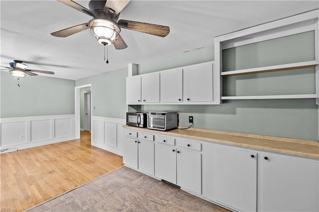 209 Jarvis Rd, Chesapeake, VA 23323 - kitchen with ceiling fan, black microwave, open shelves, light countertops, and white cabinets