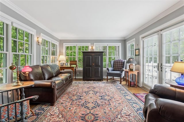 sunroom / solarium with french doors, crown molding, and wood finished floors