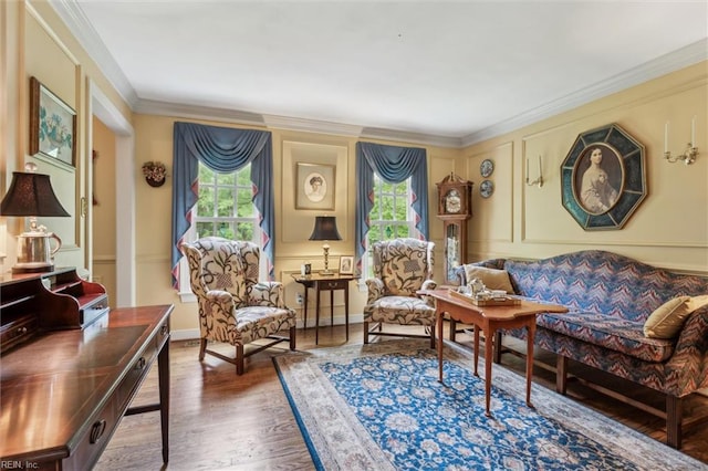 sitting room featuring wood finished floors and ornamental molding