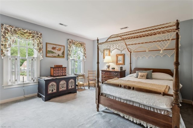 carpeted bedroom with baseboards