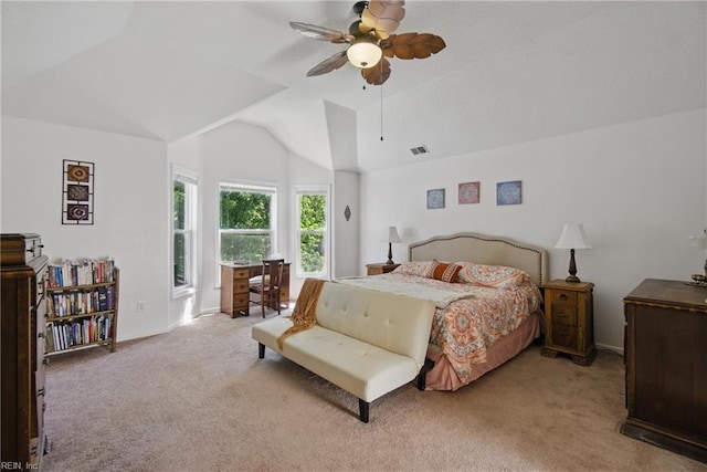 carpeted bedroom featuring vaulted ceiling, baseboards, and a ceiling fan