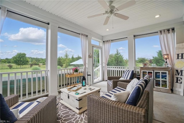 sunroom with an outdoor living space, ceiling fan, and recessed lighting